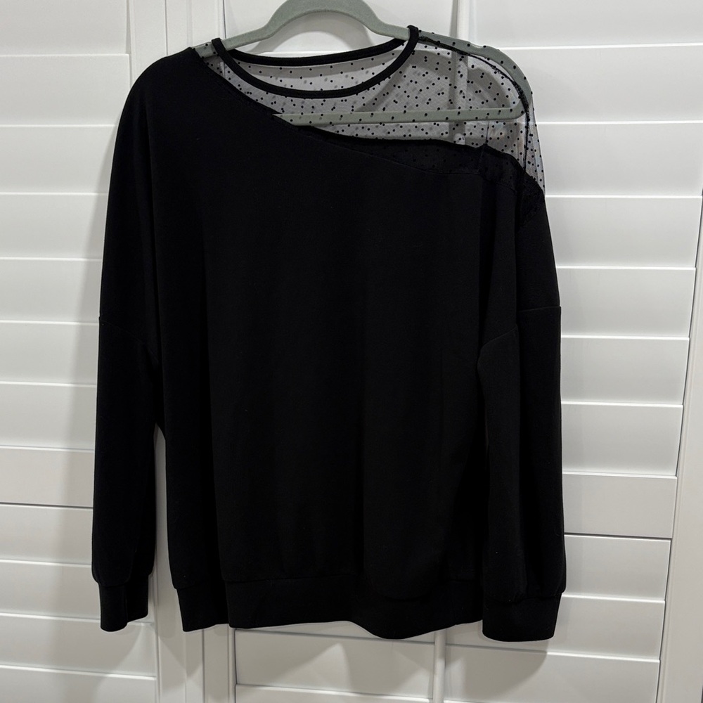 Elegant Black Sweater with Sheer Polka Dot Accent